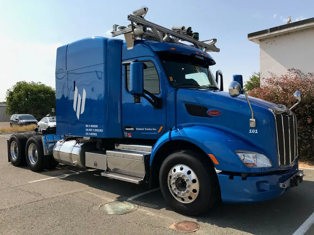 An Embark autonomous Peterbilt truck with roof-mounted sensors on display in 2018.