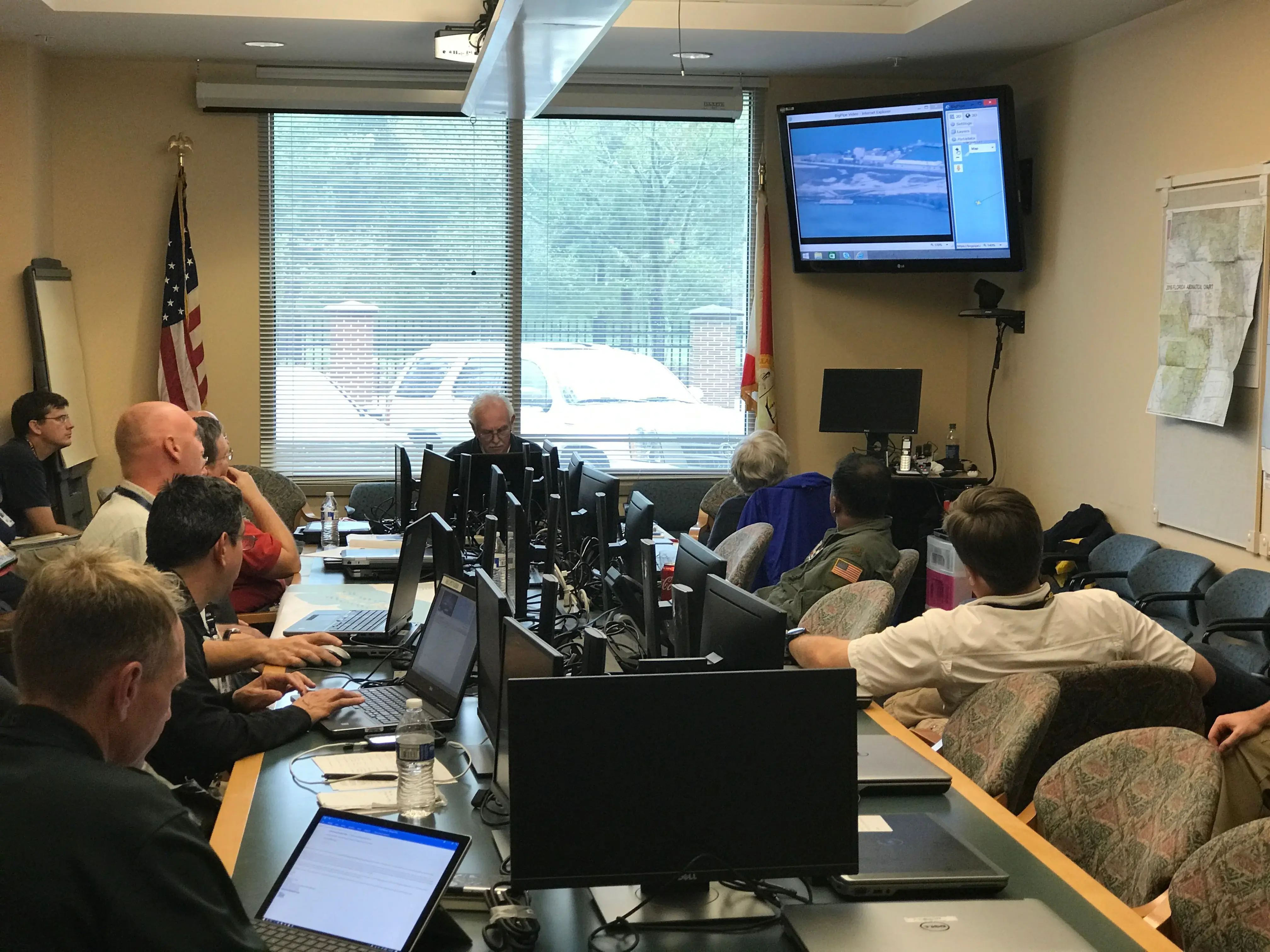 Emergency officials view a CBP unmanned-aircraft video feed during Hurricane Irma response in 2017.