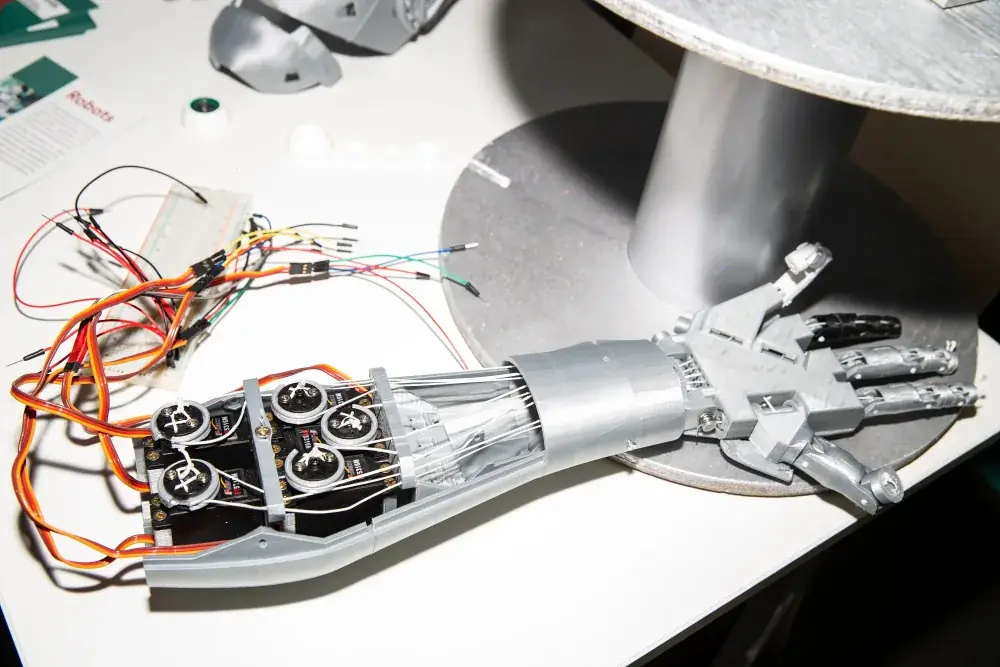Related dexterous hardware: an articulated robotic forearm and hand at VivaTech. This is not the experiment described in this brief.