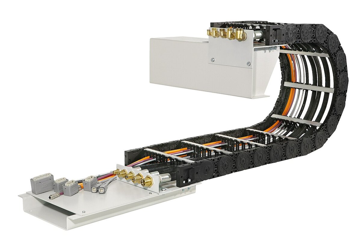 An industrial cable-carrier system, illustrating how moving machinery routes and protects cables.