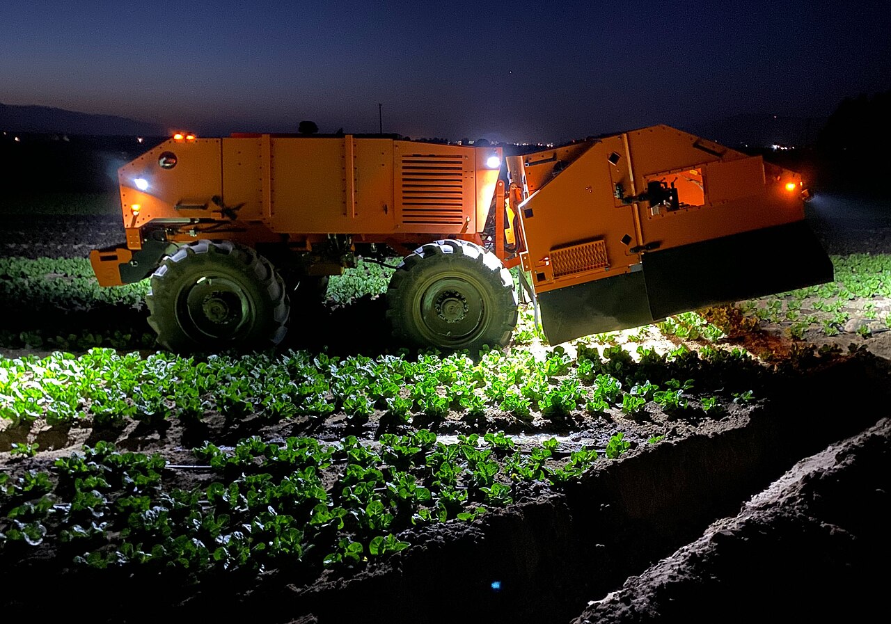 Related outdoor autonomy: FarmWise’s Titan FT-35 working in a lettuce field in 2020; not ASI construction equipment.
