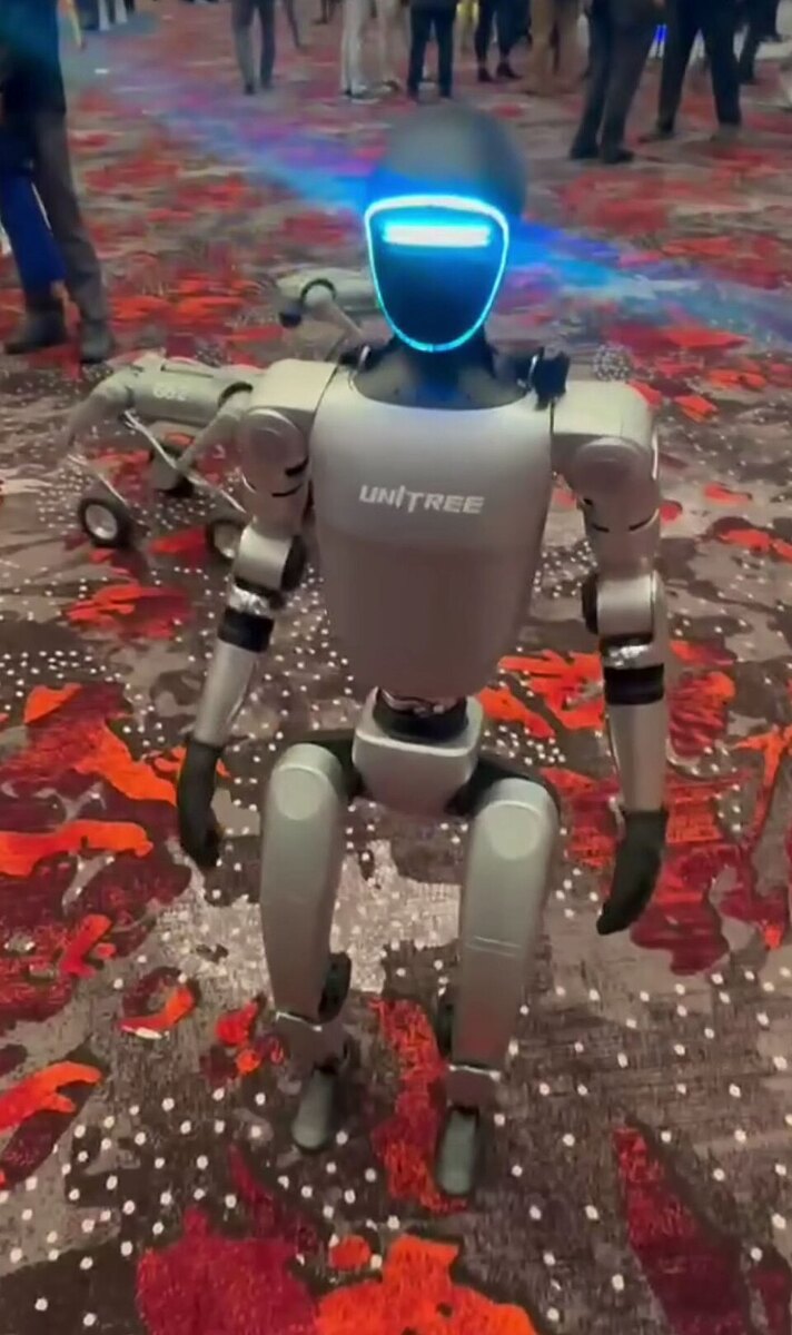 Unitree G1 humanoid robot displayed at an expo, an earlier model than H2 Plus